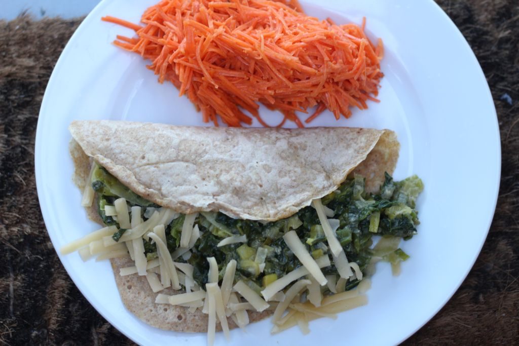Wholewheat crepes with sauteed leeks, kale and vegan cheese plus Frenach carrot salad