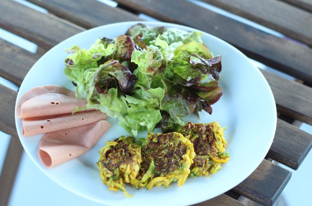 Flat curried courgette falafels with vegan ham and green salad